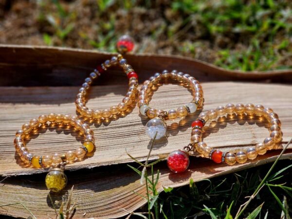 Golden brown beads with ball charms